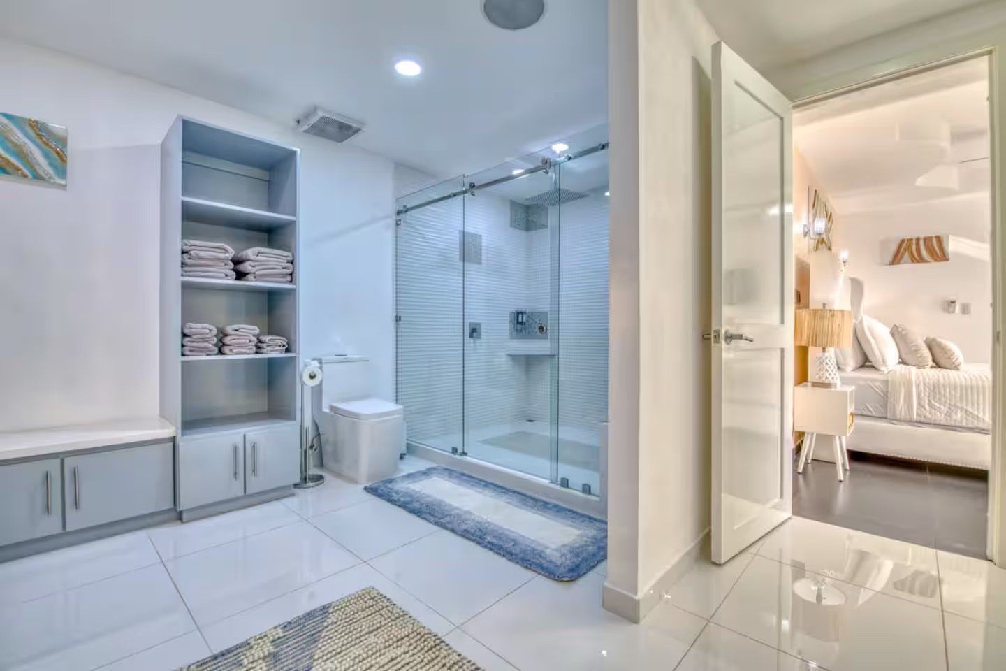 Bright modern ensuite bathroom and bedroom