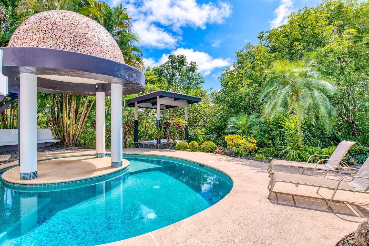 Private poolside lounge at the Costa Rica retreat surrounded by tropical garden