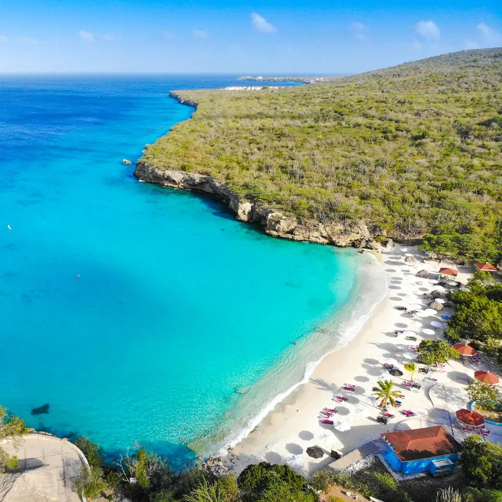 Sheltered turquoise bay and white sand beach in Curaçao